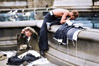 0_These-young-women-and-a-sailor-appear-to-have-slept-out-in-Trafalgar-Square-in-preparation-f...jpg