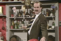 1483542588-fawlty-towers-basil-fawlty-john-cleese-bar-trick-funny.gif