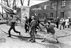 A woman hitting a neo-Nazi with her handbag, Sweden, 1985.jpg