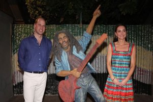 William and Kate Windsor standing either side of Bob Marley statue smiling awkwardly.jpg