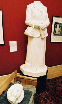 marble Thatcher statue indoors with head chopped off