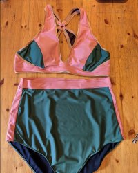 A pink and dark green bikini with very high waisted bottoms