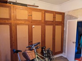 A row of panelled wooden cupboards 