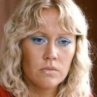 A sad Swede. Agnetha Fältskog, in blue eyeliner, looking downcast. 