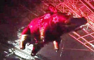 A flying pig with symbols including the Star of David projected onto it.