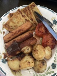 A delicious fried spread, consisting of the above items, sits invitingly on a plate. It is well cooked and delicious looking. You wish it was yours. 