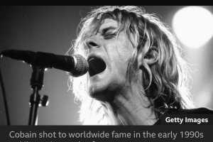 A picture of Kurt Cobain captioned “Cobain SHOT to fame in the early 1990s”.