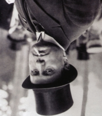 Mussolini in top hat upside down.png