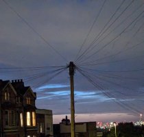 dusk sky looking over the London skyline, reddish along the horizon with streaks of very light blue higher up