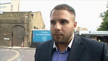 DAN WOOTTON CRYING OUTSIDE NEWS INTERNATIONAL WAPPING CLOSURE OF NOTW - ANIMATED.gif