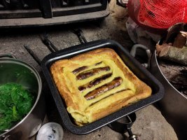 A tray of fit as fuck toad in the hole next to a pan of kale