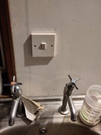 Light switch on the wall directly above my kitchen sink