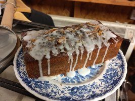 Marmalade loaf cake with marmalade glaze and white water icing drizzled over the top