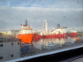 Ships docked at Aberdeen, seen through the ferry window 