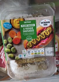 a pack of veggie sausages being taken out of the freezer