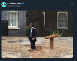 Picture of Sunak and the lectern in Downing Street.   He is almost knee deep in polluted water