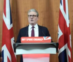 keir starmer looking serious stood behind lectern, with two union jack flags behind him.  Placard on lectern now reads 'any spare change?'