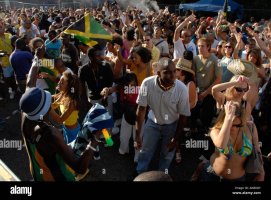 multicultural-group-dancing-in-back-street-at-notting-hill-carnival-AKB0GY.jpg