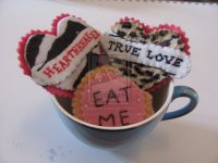 __eat_me___biscuit_brooches_by_thewhiteflamingo-d3osfm7.jpg