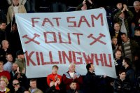 West-Ham-fans-with-a-banner-Fat-Sam-Out.jpeg