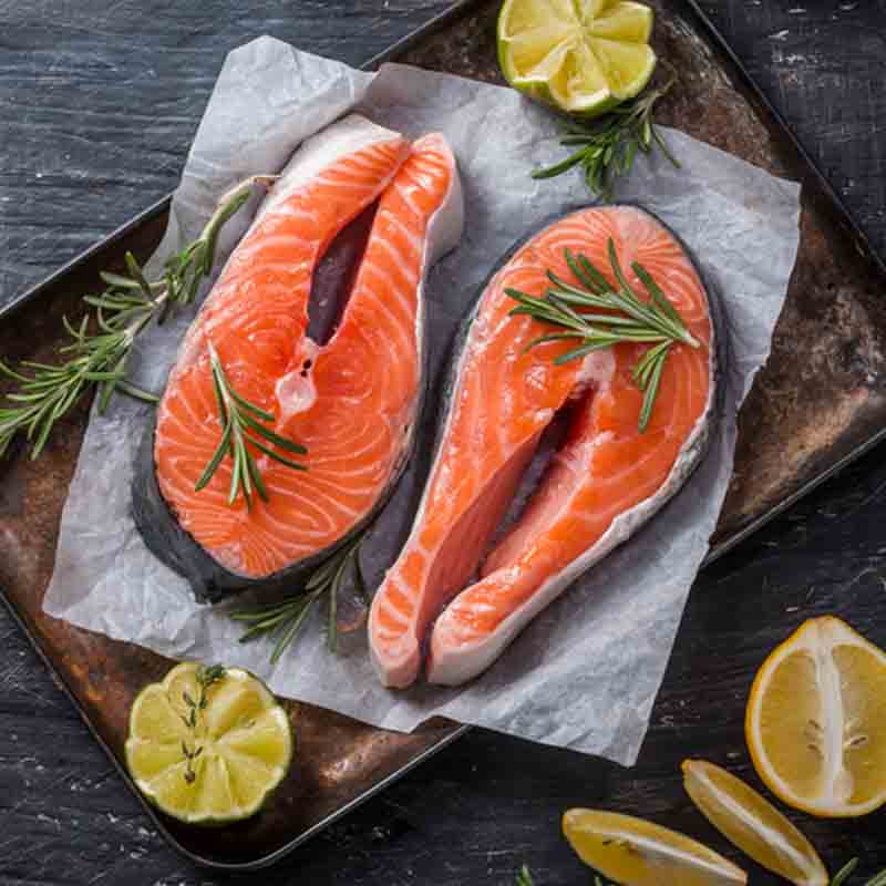 two salmon fillets with the tasty spines clearly visible