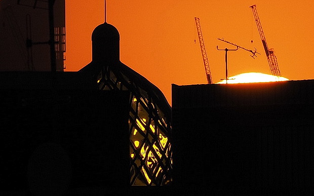 Beautiful Brixton sunset reflected in an emerald-glazed dome