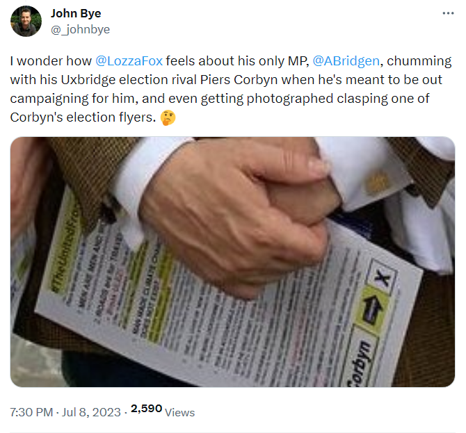 Close up of Bridgen holding one of Piers Corbyn's leaflets