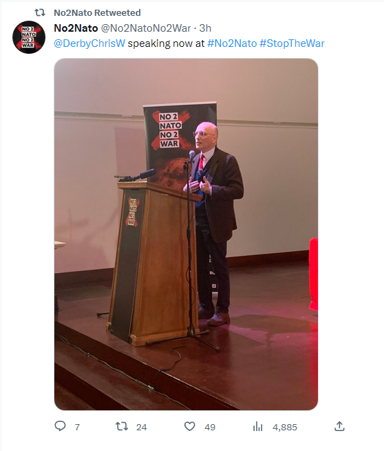 Chris Williamson stands out in the red-brown decor