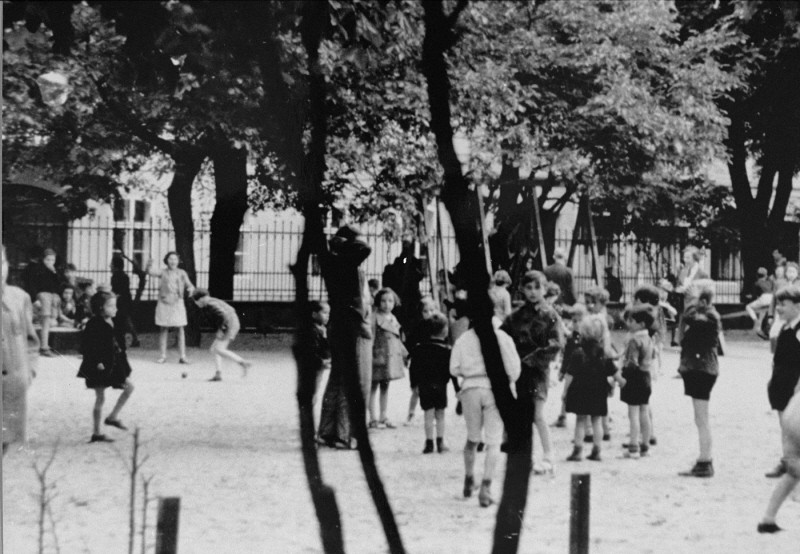 A scene staged by the Nazis for an International Red Cross inspection of the Theresienstadt ghetto. [LCID: 73359a]