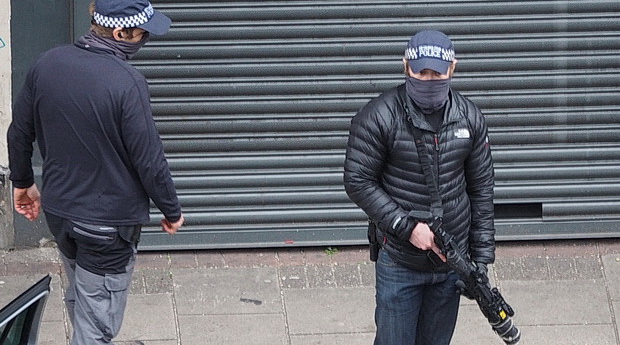 In photos: Armed and masked police officers make an arrest on Brixton's Coldharbour Lane, Mon 30th March 2020