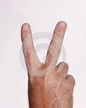 hand-holding-up-two-fingers-largethumb10830906.jpg