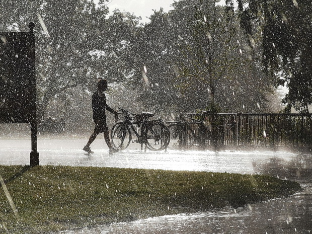 Dancing in the rain - a sudden rain storm in Brockwell Park, south London