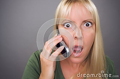 stunned-blond-woman-using-cell-phone-thumb7746321.jpg