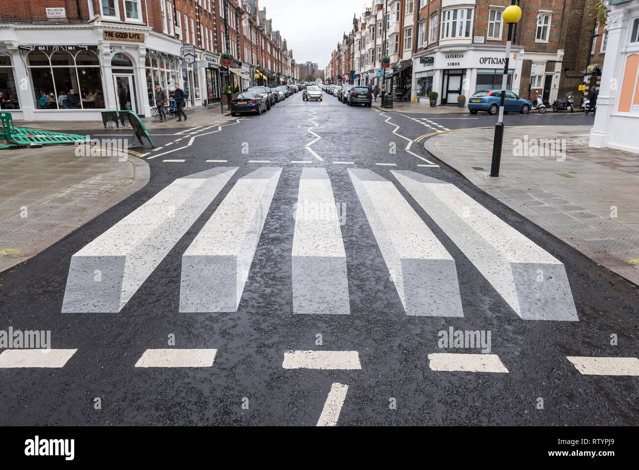 london-uk-3-march-2019-a-trial-3d-style-zebra-crossing-has-been-installed-in-st-johns-wood-high-street-by-the-local-council-the-3d-design-is-supposed-to-give-the-illusion-to-oncoming-drivers-that-the-surface-is-raised-to-cause-vehicles-to-slow-down-should-the-trial-be-successful-further-similar-crossings-will-be-installed-in-the-area-credit-stephen-chung-alamy-live-news-RTYPJ9.jpg