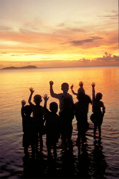 Children%20waving%20at%20sunset.jpg