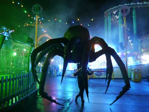 a giant spider about to eat a human