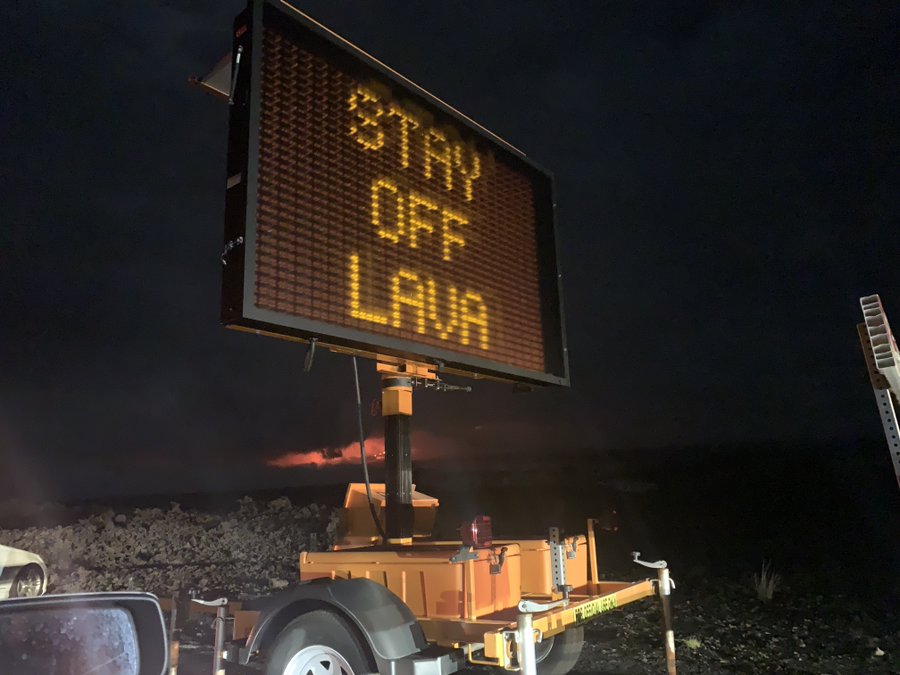 mobile sign by a lava field saying 'stay off lava'