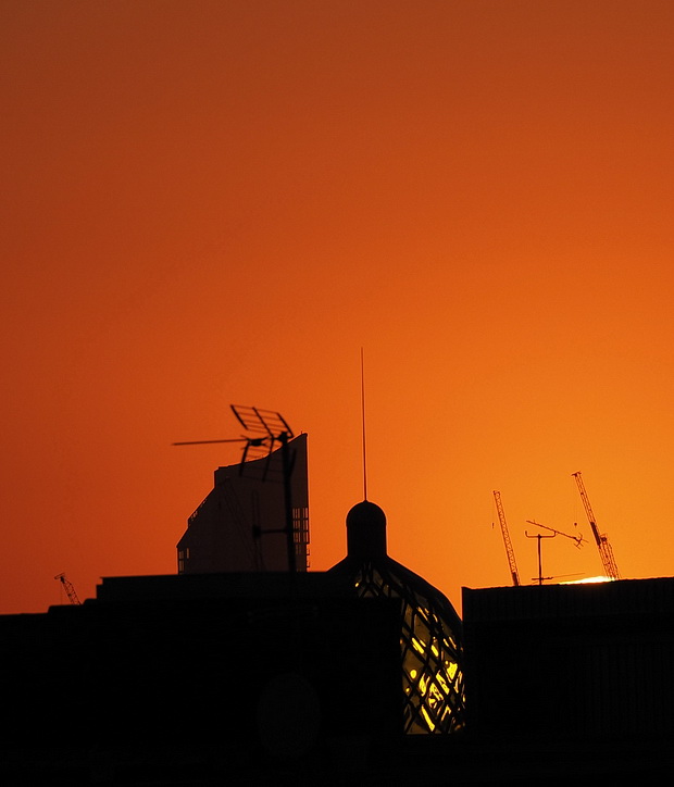 Beautiful Brixton sunset reflected in an emerald-glazed dome 